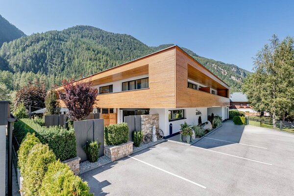 Modern architecture with lots of greenery all around at your Ötztal vacation apartment